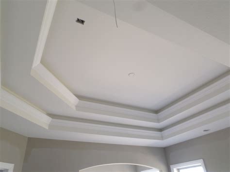 My design uses polystyrene cove molding which is about 40% cheaper than the primed wood cove molding. Coffered ceiling by Miller Construction. | Coffered ceiling