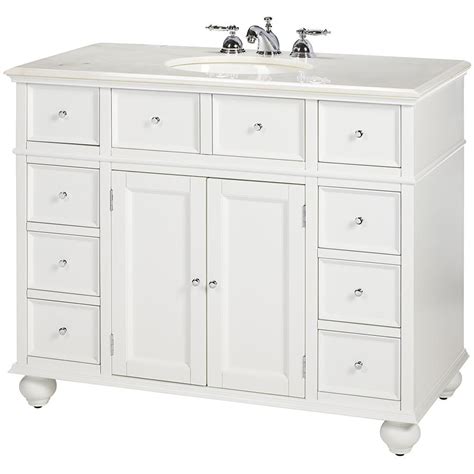 A White Bathroom Vanity With Two Sinks And Drawers