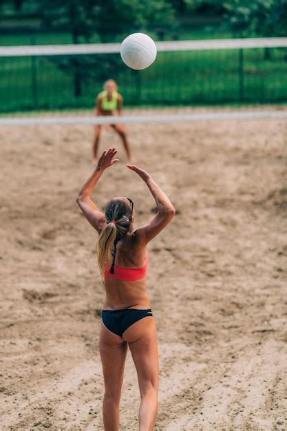 Premium Photo Beach Volleyball Female Player Serving The Ball