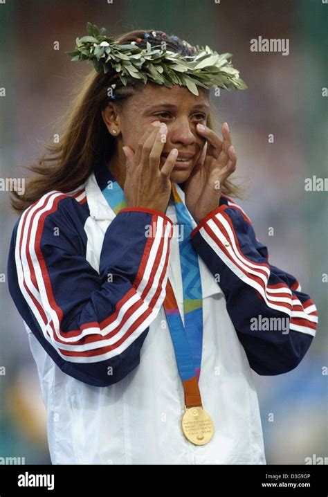 Dpa Olympic Champion Joanna Hayes From The United States Wipes Away Tears Of Joy After
