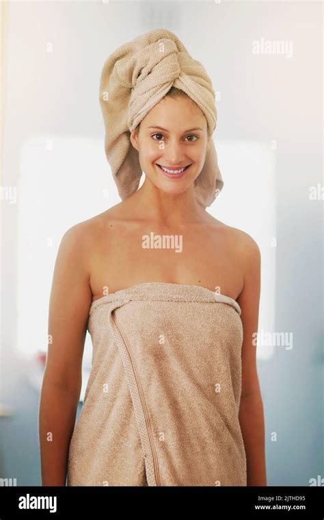 Starting Her Day Fresh And Clean Portrait Of A Woman Wrapped In Towels After Her Shower Stock