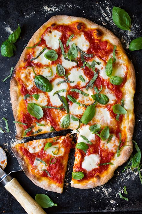 A light pizza with olive oil, garlic, fresh basil, fresh tomatoes, mozzarella and parmesan cheeses. Margherita Pizza (Easy Delicious Recipe!) - Cooking Classy