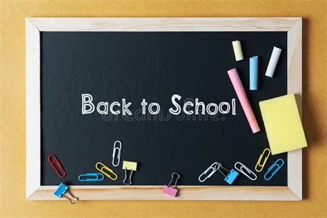 School Supplies On Black Board Background Back To School Concept Stock