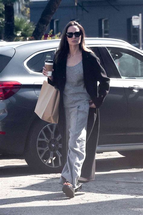 Angelina Jolie Swears By Long Black Trench Coats