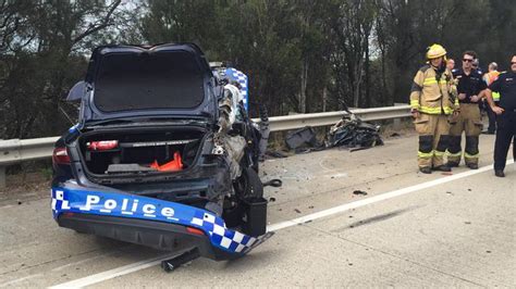 m1 chaos as truck rolls on to police car on gold coast s m1 motorway gold coast bulletin