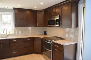 It depends on the exact kitchen cabinet painting service you require. 1980's Kitchen Update - Wood Palace Kitchens, Inc.