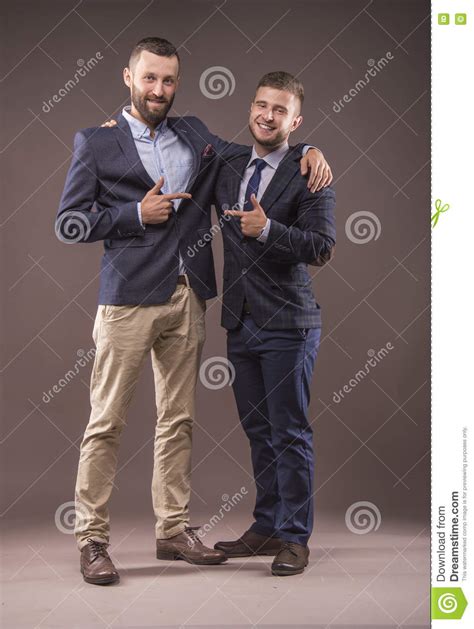 Two Men In Suits Hugging Royalty Free Stock Photo