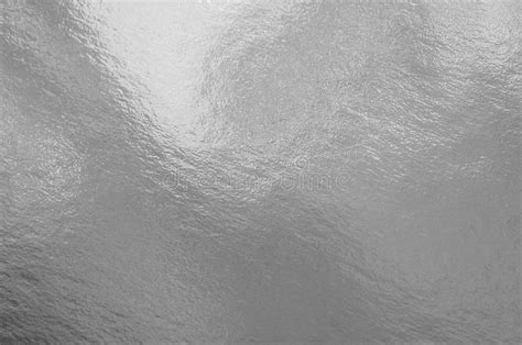 Silver Foil Texture Background With Highlights And Uneven Surface Stock