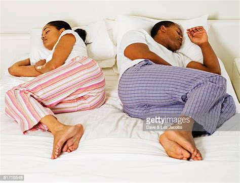 Black Couple Sleeping In Bed Photos And Premium High Res Pictures Getty Images