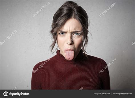 Angry Young Woman Showing Her Disgust Having Gloomy Expression Showing — Stock Photo © olly18 ...