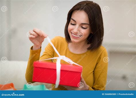 Happy Young Woman Sit On Couch Unpack Cardboard Box Stock Photo Image