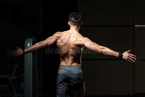 Muscular Man Flexing Back Muscles Pose Stock Photo Image Of Portrait