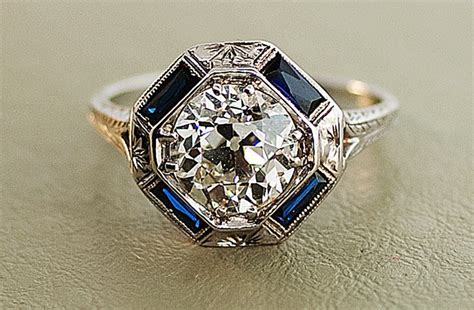 1.17 ctw pear diamond vintage half halo engagement ring. 1920s antique engagement ring with center diamond and sapphire accents | OneWed.com