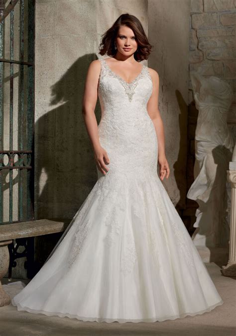 Beautifully embroidered with crystals and pearls on bodice, down the dress skirt and on 3 foot train. Embroidered Appliques on Tulle with Swarovski Crystal ...