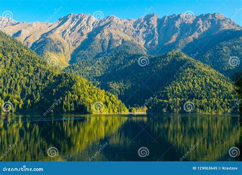Beautiful Mountain Lake With Green Forest Hills At The Shore Ritsa