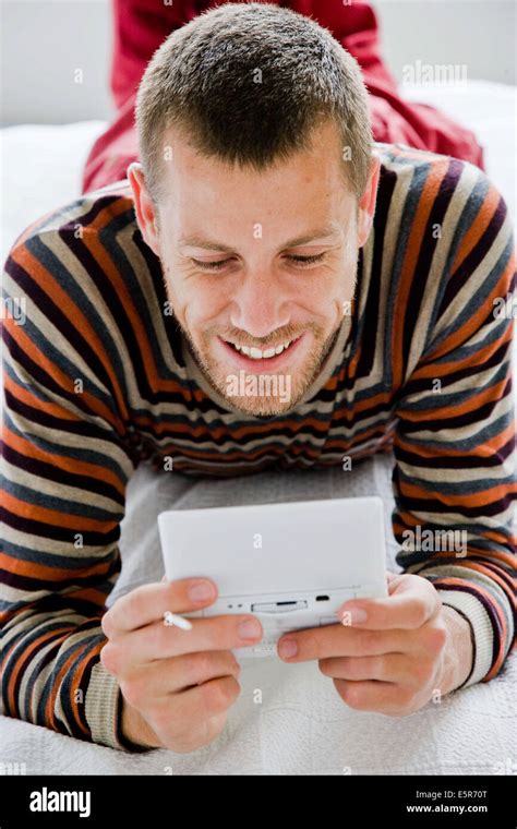 Man Playing With A Video Game Console Stock Photo Alamy