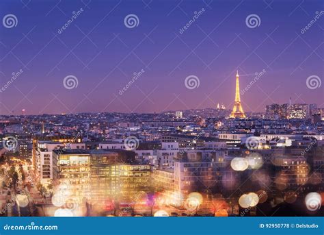 Eiffel Tower Illuminated At Night With Bokeh Lights Montmartre In The