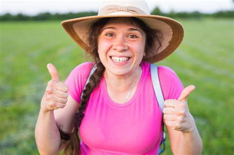 Portrait On Cute Funny Laughing Woman With Freckles In Hat Showing