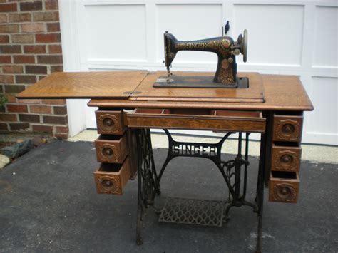 early 1900s singer treadle sewing machine with 7 drawer tiger oak cabinet b… treadle sewing