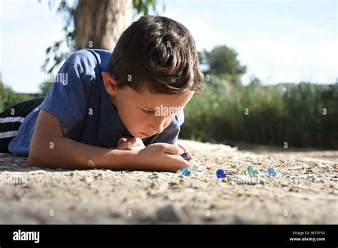 Boy Playing Marbles High Resolution Stock Photography And Images Alamy