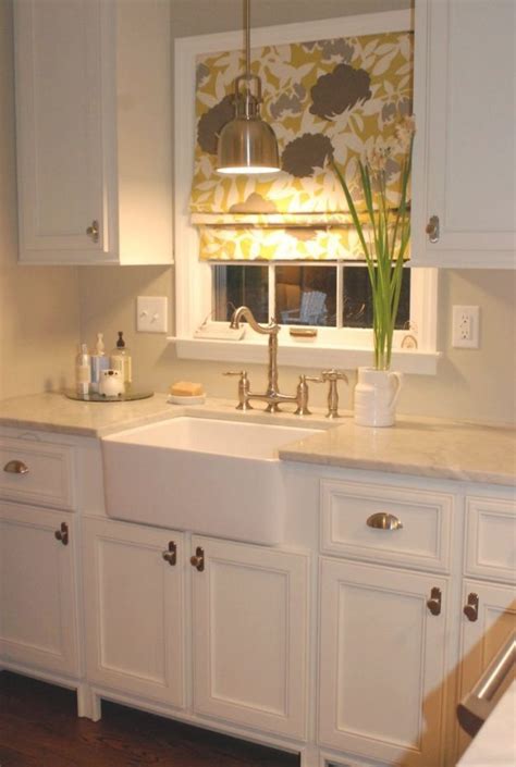Lights with a minimalist aesthetic are a popular trend for modern kitchen sink lighting. Image Result For Light Fixture Over Sink In Front Of ...