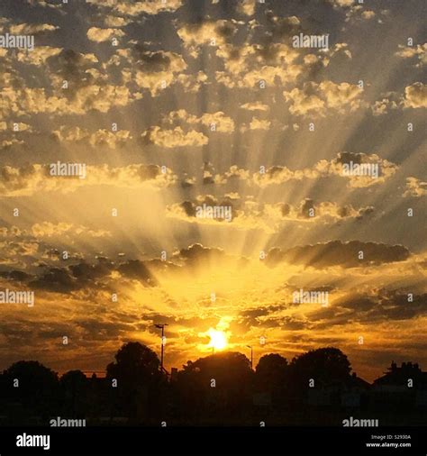 God Rays At Sunset Stock Photo Alamy