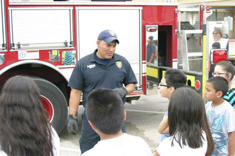 Fire Chief Surprises Students Hands Over Hose