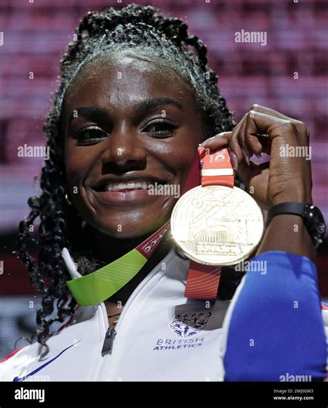 Britains Dina Asher Smith Holds Up Her Gold Medal During The Awards Ceremony For The Womens