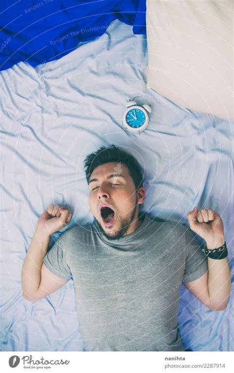 Young Man Yawning In His Bed A Royalty Free Stock Photo From Photocase