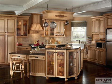 You should sand cabinets before beginning your how to paint kitchen cabinet project to give the new paint a good surface to grip. This traditional kitchen with KraftMaid cabinetry and a ...