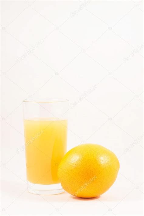 Freshly Squeezed Orange Juice In A Glass And Orange Stock Photo By