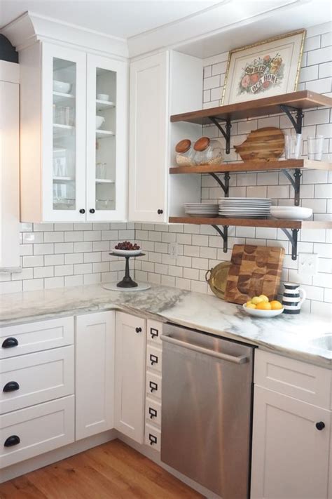 Replacing the upper cabinets with open shelving has become a popular trend in recent years. Of Kitchen Cabinets & Open Shelves