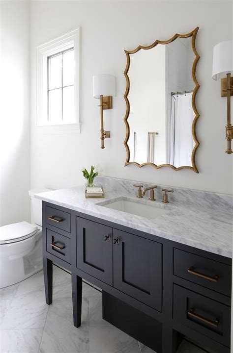 In this bathroom, the frame on the mirror is enough to make this vanity pop. Black Single Washstand with Gold Leaf Mirror ...