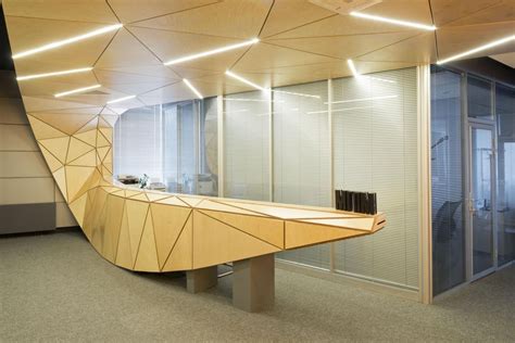 A Curved Wooden Bench In An Office With Glass Walls And Doors On Either