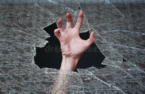 hand make their way through the broken glass royalty free stock image image 25980506