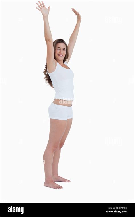 Smiling Woman Raising Her Arms Above Her Head Stock Photo Alamy