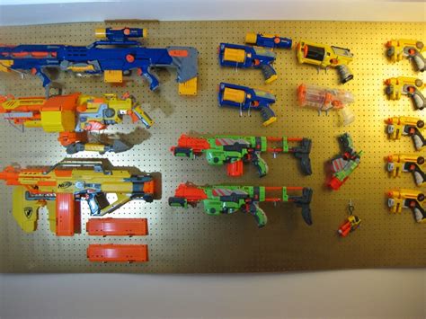 Mounts can be horizontal or vertical, please specify which you prefer. Wall Mounted Nerf Gun Rack : Jullian's Nerf peg board gun rack for his collection of ... : We ...