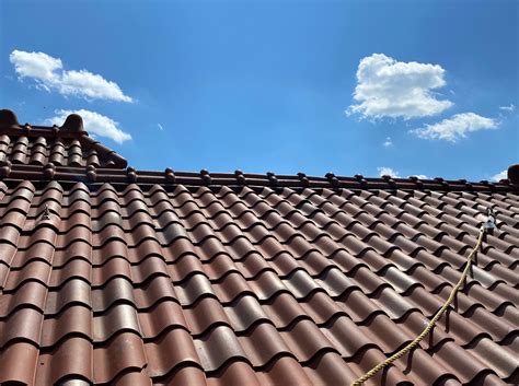 Permanent roof anchor for Spanish tile roofs.