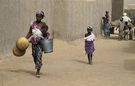 A Young Woman Carries Water Buckets A Woman Carries Water Flickr