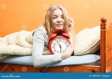 Woman Waking Up With Alarm Clock In Morning Stock Photo Image Of Wool