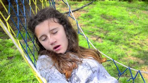 Young Teen Girl Swing And Sleep In Hammock Yawning Stock
