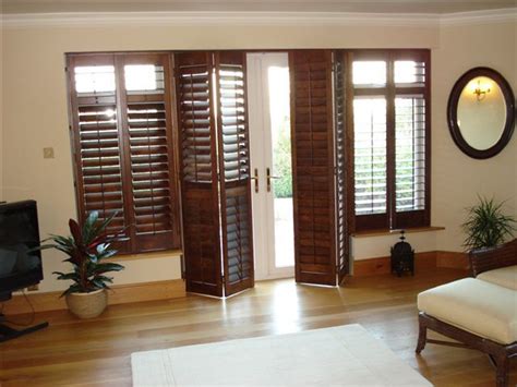 Wooden shutters for bay windows. indoor french door shutters | Black Walnut 64mm shutters ...