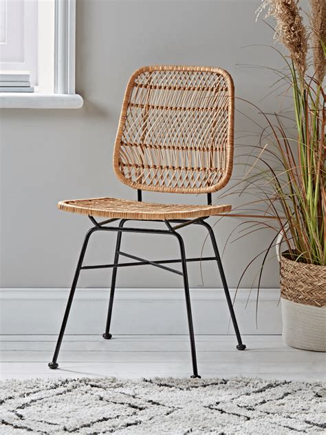 Wicker dining chairs offer an affordable way to add a designer element to your dining area. Woven Wicker Dining Chair in 2020 | Wicker dining chairs ...