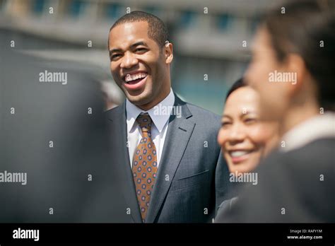 Young Businesspeople Laughing Together Stock Photo Alamy