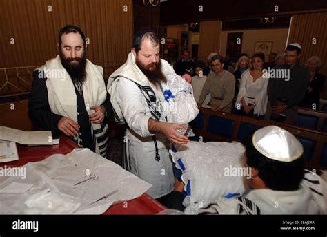 A Brit Milah Ceremony Takes Place On The Bimah Of The Synagogue In The