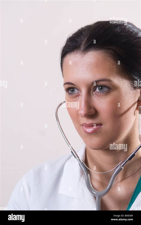 Doctor Listening Through Stethoscope Stock Photo Alamy