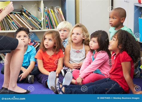 Elementary Pupils In Classroom Working With Teacher Stock Image Image