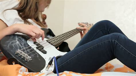 Stock Video Of Teen Girl Playing Bass Guitar At 9018145