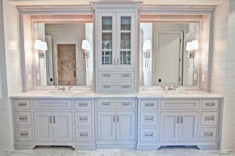 The countertop is in quartz, and classic subway tiles were used in the combined bathtub/shower. Bathroom Tower Cabinet Gorgeous Double Vanity With Center ...