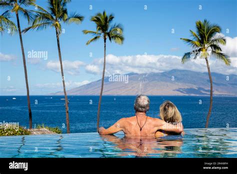 Couple Enjoying The Infinity Pool At The Four Seasons Resort Maui
